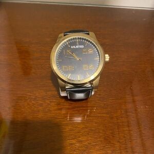 This is a new/never been used Keneth Cole Unlisted Mens watch.